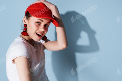 Preview: young woman in red cap summer fashion posing isolated background