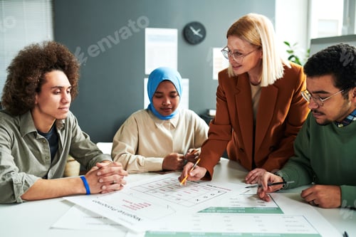 Preview: Confident teacher in eyeglasses explaining information in document
