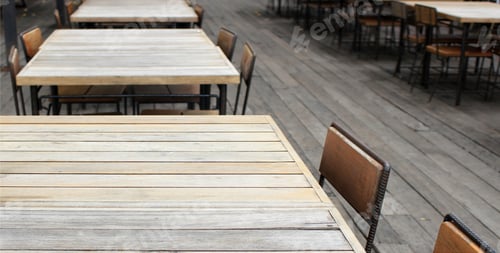 Preview: Empty outdoor old vintage wood table and chair in coffee shop restaurant