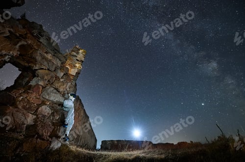 Preview: Spaceman enjoying beautiful view starry sky.
