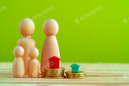 Preview: Wooden family with toy house and stack of coins. Savings for house purchase concept