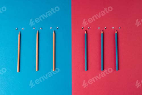 Preview: Composition of pencils with eyes on blue and pink surface