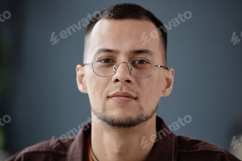 Preview: Close Up Asian Man Against Grey Wall