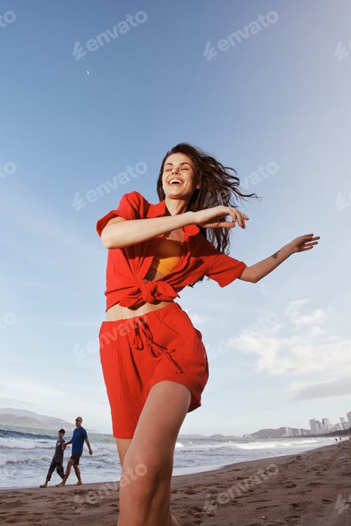 Preview: Joyful Summer Dance: a Smiling Woman Embracing Freedom by the Sea