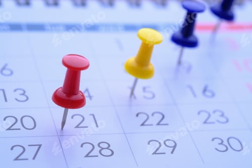 Preview: Bright and Colorful Push Pins on Calendar Dates for Enhanced Organization and Efficient Scheduling