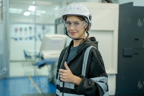 Preview: Engineer checking and operation controlling automated robot hand with CNC machine.