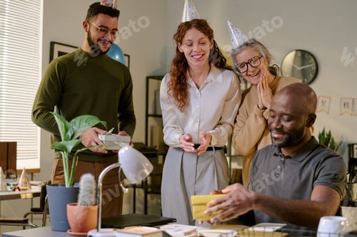 Preview: Diverse Young Adult and Senior Colleagues Celebrating Birthday at Office