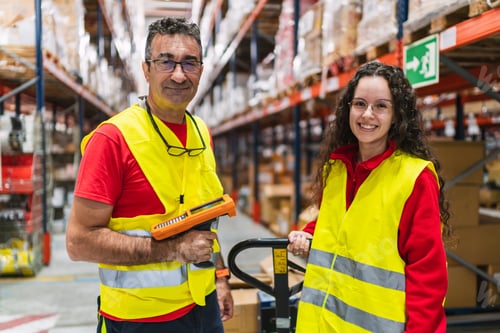 Preview: Warehouse workers managing inventory with barcode scanner and pallet jack