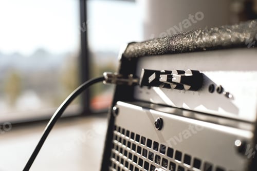 Preview: Powerful sound of your guitar. Close-up view of guitar amplifier with cable audio jack