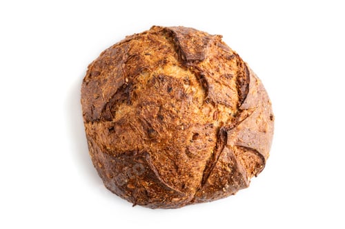 Preview: Fresh homemade golden grain bread with wheat and rye isolated on white, top view, close up.