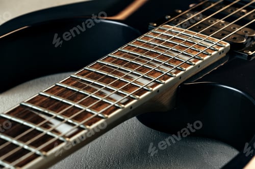 Preview: Guitar fingerboard with strings close up photo