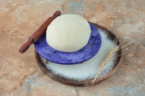 Preview: Dough with rolling pin and flour on marble background