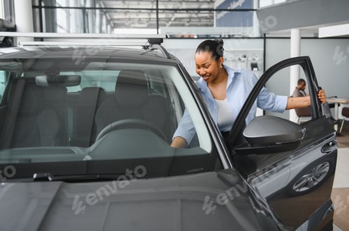 Preview: Customer choosing new car in dealership showroom