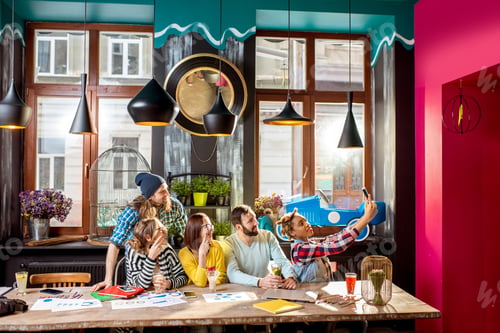 Preview: Friends making selfie photo in the cafe