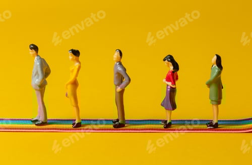 Preview: Group of figures of people stands on rainbow strip