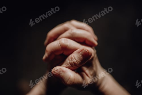 Preview: Close up of wrinkled praying hands, copy space.