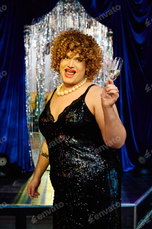 Preview: Bold drag queen performing with flair at a vibrant holiday stage show