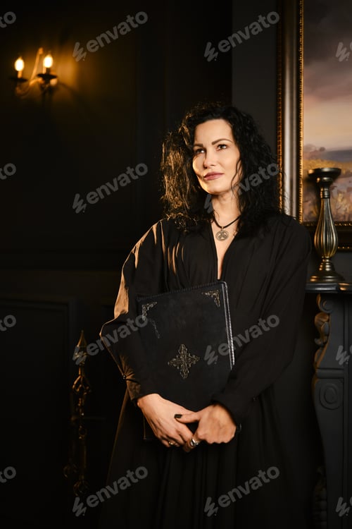 Preview: Woman holding a book while standing in a dark room with a painting on the wall