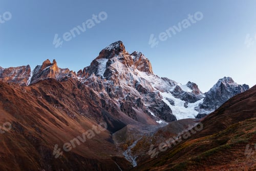 Preview: Autumn landscape and snow mountains in beautiful cumulus clouds. Main Caucasian Ridge. Type Mount