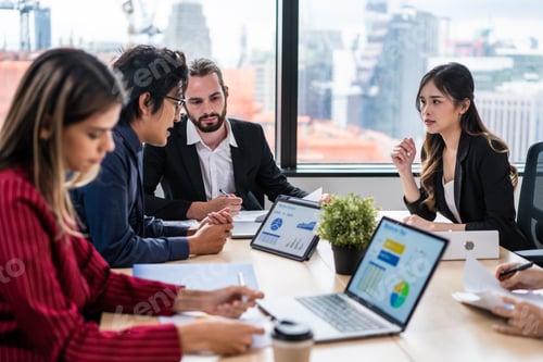 Preview: Group of multi-Ethnic businessman and businesswoman working in office.