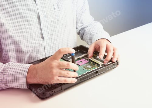 Preview: Man repairs computer