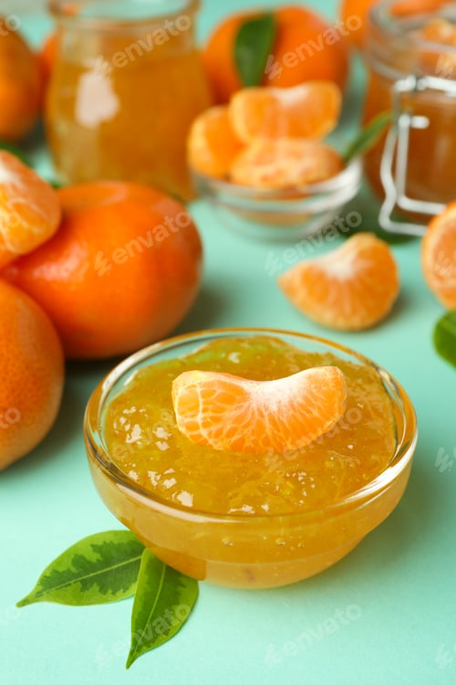 Preview: Mandarin jam and ingredients on mint background, close up