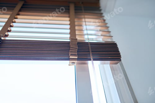 Preview: Brown wooden blinds in the interior close-up