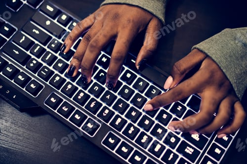 Preview: Closeup of hands working on computer keyboard