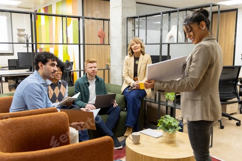 Preview: Diverse business team collaborating during office meeting