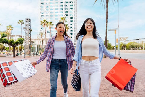Preview: Happy beautiful chinese women friends bonding in the city