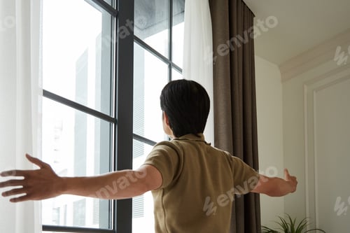 Preview: Young Man Opening Curtains