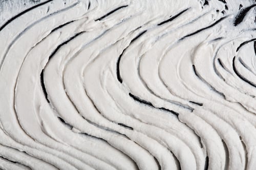 Preview: Structural Plaster White On A Black Background. White Cream. Paint Smear. Plasticine