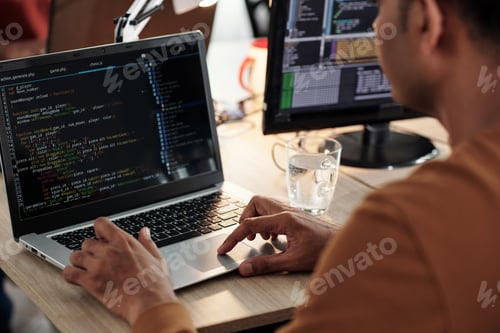 Preview: Software Developer Coding on Laptop