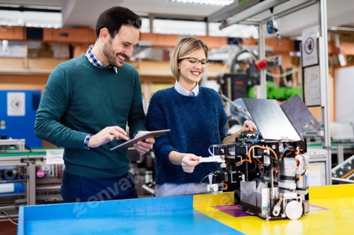 Preview: Young students of robotics working on project