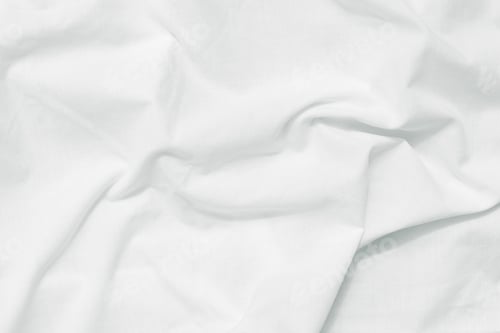 Preview: White crumpled bed sheet background, top view. Natural fabric pattern, wrinkle texture