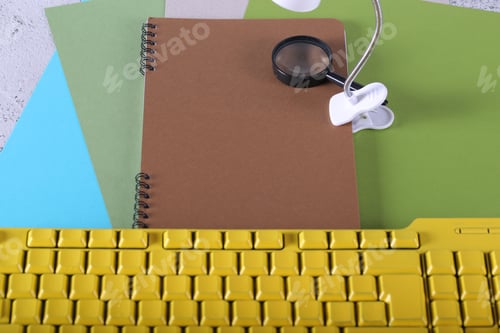 Preview: Paper Lamp Notebook And Keyboard Are On The Table