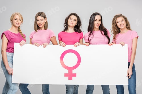Preview: happy women holding large sign with female symbol isolated on grey