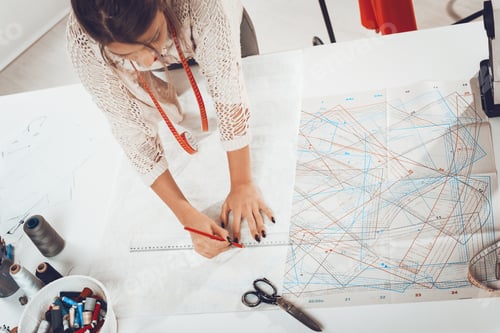 Preview: Woman Tailor With Sewing Pattern