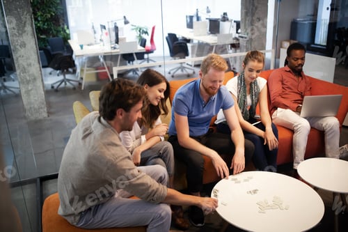 Preview: Group of multiethnic business people having corporate fun in office