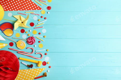 Preview: Colorful birthday accessories on blue wooden background, flat lay. Space for text