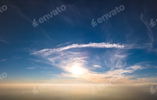 Preview: Bright colorful sunset sky with setting sun and vivid soft clouds. Concept of nature and environment