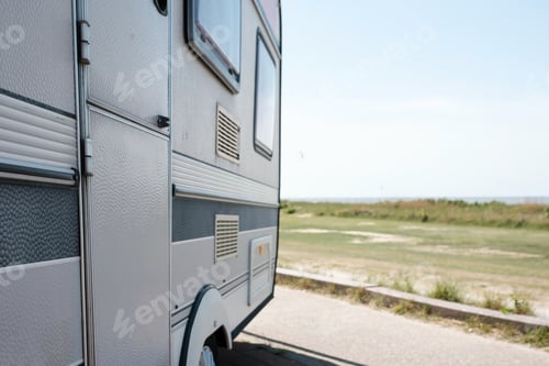 Preview: mobile home stands on the seashore near the road
