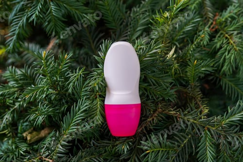 Preview: Deodorant or antiperspirant bottle on green nature background, natural body care products