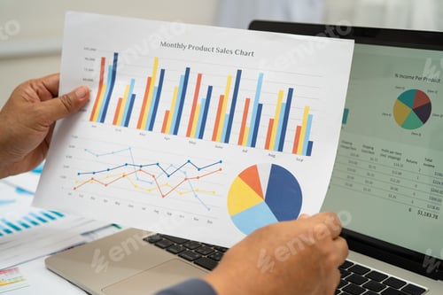 Preview: Asian business woman working with financial graph.