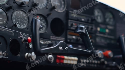 Preview: Modern airplane steering wheel inside small private aircraft cockpit close up.