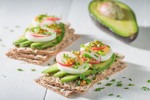 Preview: Tasty sandwich with avocado, radish and eggs