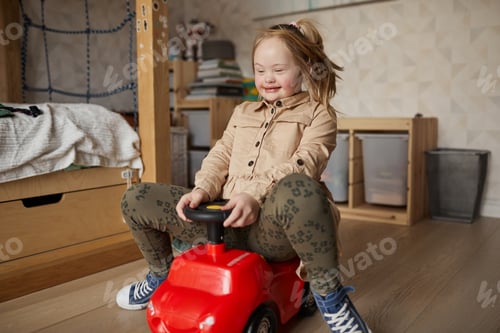 Preview: Cute Girl with Downs Syndrome Playing at Home