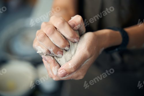Preview: Unrecognizable woman holds clay preparing artisan for creating ceramics products