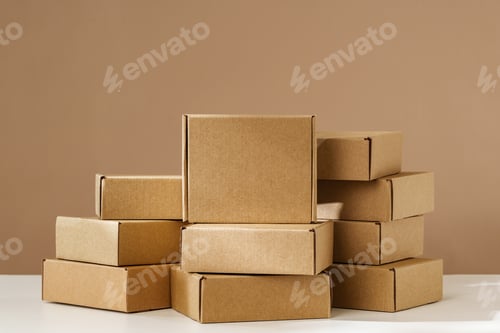 Preview: Stacked Brown Cardboard Boxes on White Surface