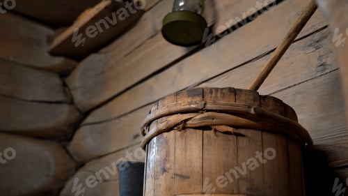 Preview: Interior of empty sauna with traditional accessories. Media. Large wooden bucket, spa room for